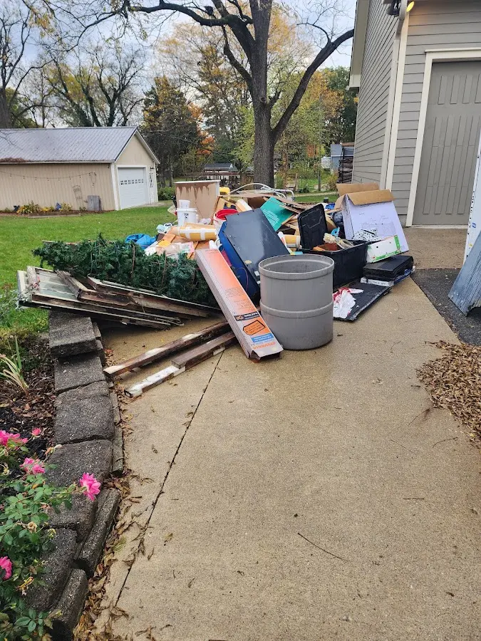 Dumpster being loaded with debris for 3 Yard Dumpster Rental in Grant-Valkaria